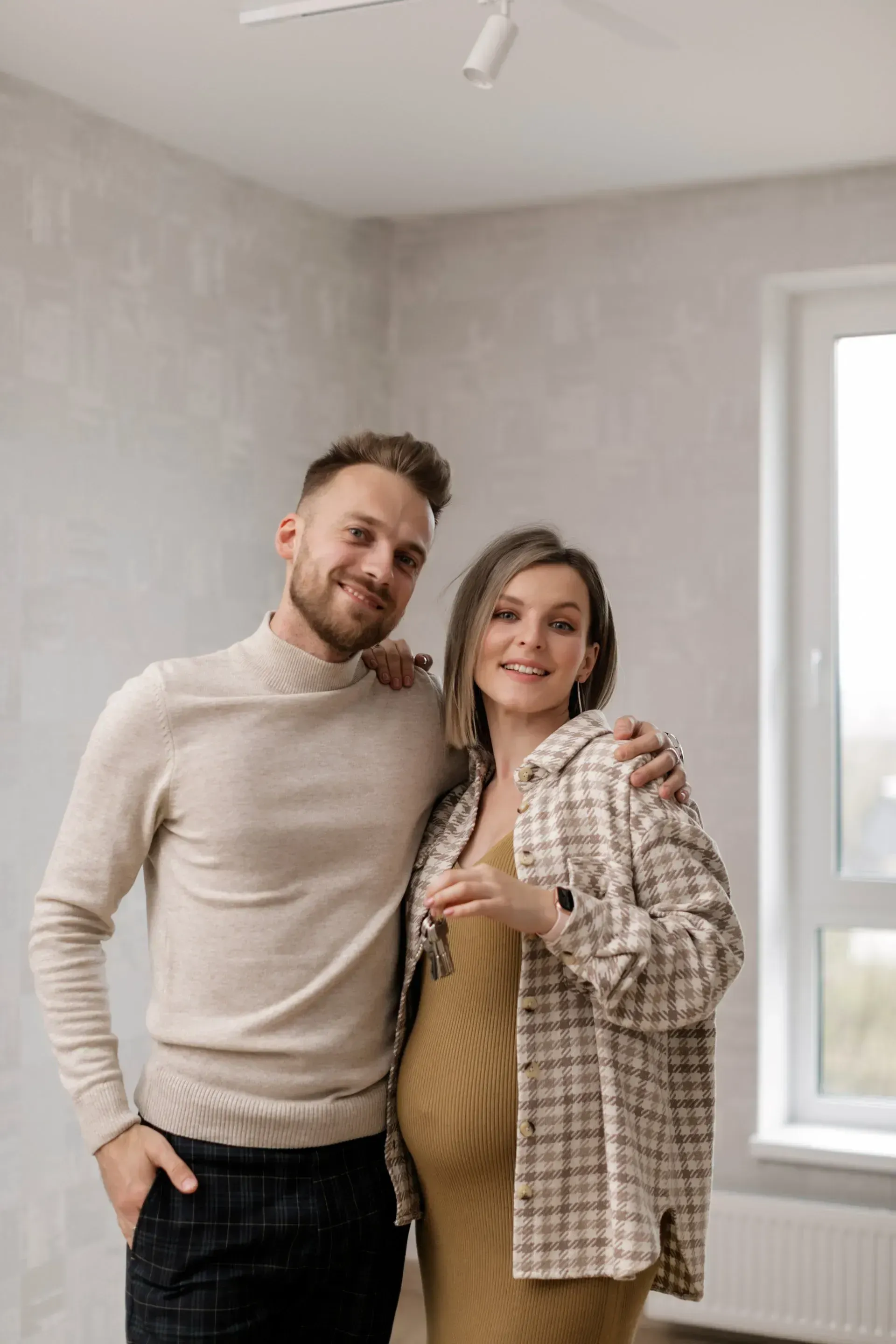 A couple standing together in their home