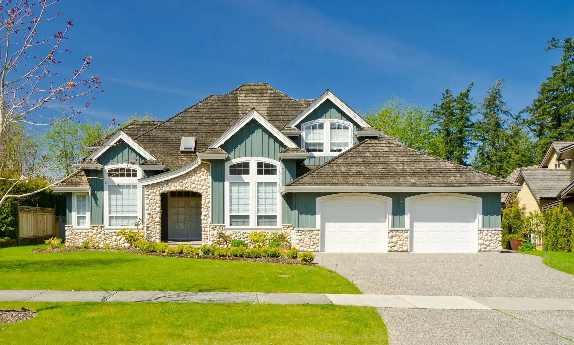 Suburban home with gray siding and white trim